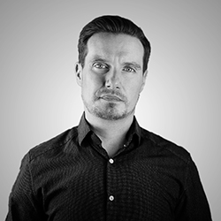 Dan Ford, Founder of Fathom, in a black-and-white studio portrait